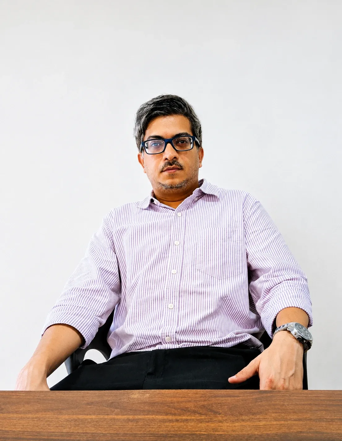 Dr. Pragnajyoti Mukherjee physician and health-tech advisor professional headshot, confident approachable expression, natural light, professional yet warm