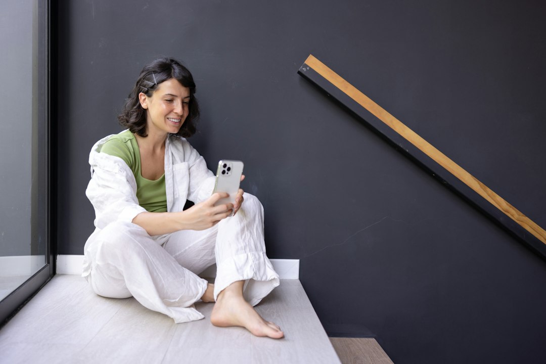 A patient in the early stages of recovery at home consulting remotely with a homeopathic practitioner on a tablet, calm and supported