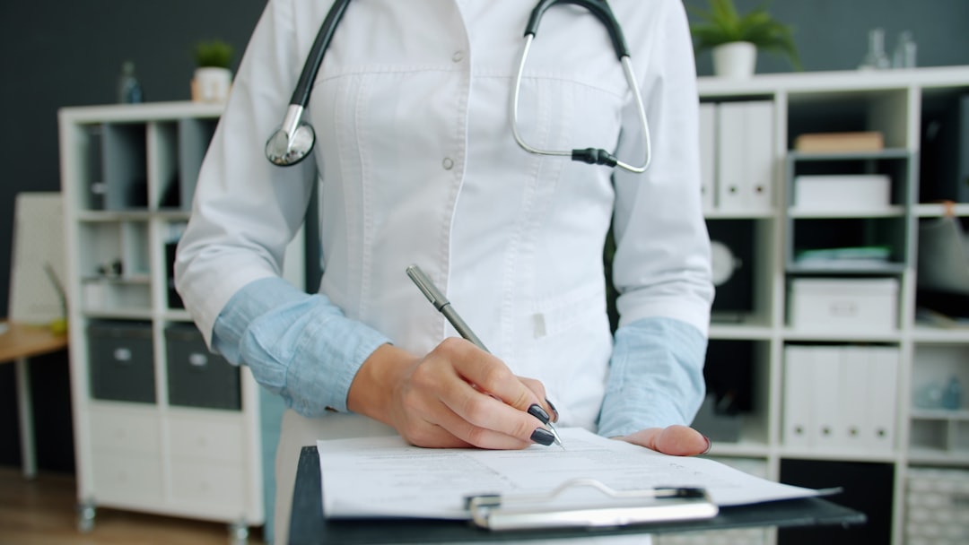 A doctor reviewing a patient's case notes and follow-up progress on a desk with a calendar and file, focused and methodical