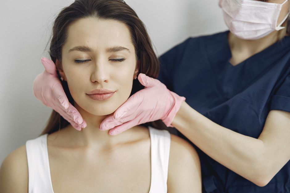 Person receiving a professional aesthetic skin treatment in a calm modern clinic, natural-looking results, reassuring